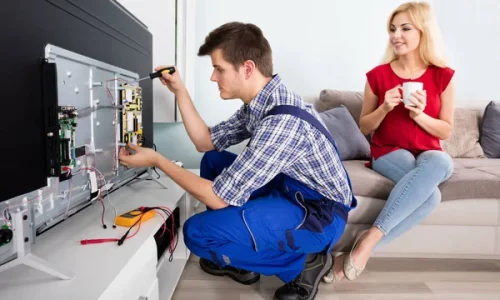 depositphotos_137860252-stock-photo-technician-repairing-television-at-home
